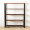 The Broadway Bookcase, a five-tier wooden bookcase with a black metal frame, stands against a white wall. The shelves are evenly spaced, and the unit rests on a light wooden floor. Its minimalist and modern design adds a touch of sophisticated elegance to any room.