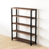 The Broadway Bookcase, featuring four evenly spaced shelves and a flat top, proudly stands against a white wall on a light wood floor. With its dark wood finish and black metal frame, this piece of furniture brings a touch of Broadway elegance to any room.