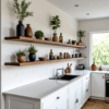 The contemporary kitchen boasts white cabinets, hardwood floors, and Hardwood Floating Shelves adorned with potted plants, jars, and bottles. It features a white tiled backsplash and a central sink below a bright window with views of greenery.